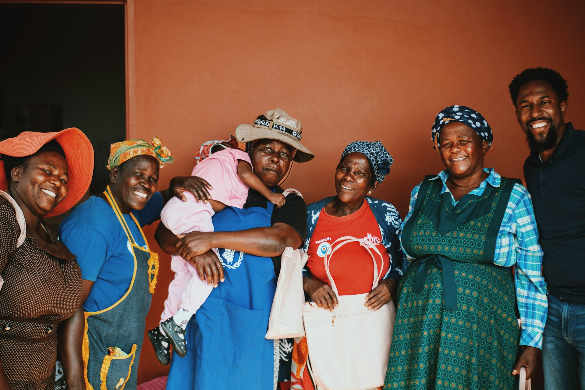 a group of people standing next to each other